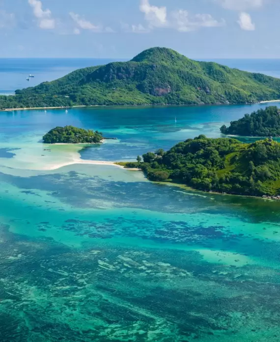Seychelles’ lush tropical islands, a top destination for luxury beach holidays and private island escapes.
