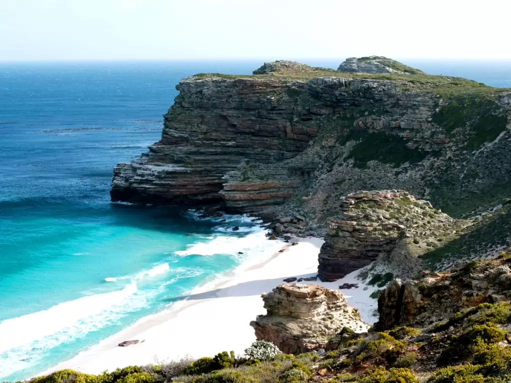Coastal cliffs, turquoise waters and white beach at Cape of Good Hope, South Africa 2025 – 2026.