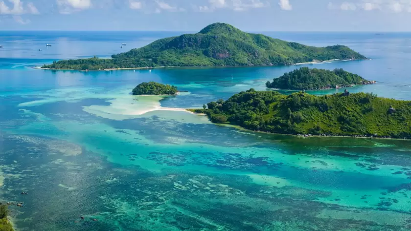 Seychelles’ lush tropical islands, a top destination for luxury beach holidays and private island escapes.