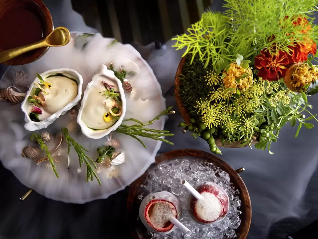 Gourmet plating of famous South African dishes, featuring seafood, reflecting fine dining innovation and local culinary heritage.