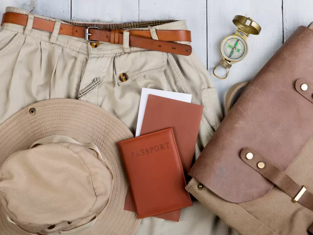Essential packing items for first-time African safaris, including khaki clothing, and a safari hat 2025 – 2026.